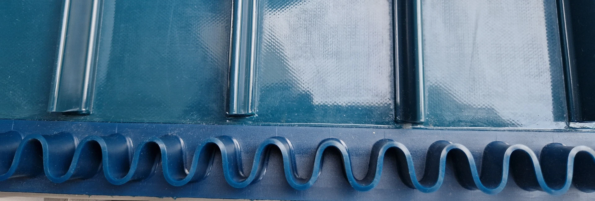 Wellenkante Fördergurt